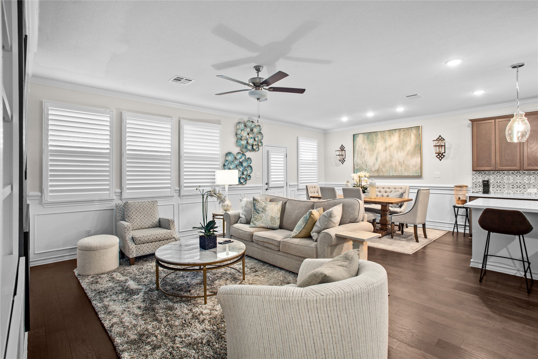 109 Adeline Road Hutto, TX 78634 - Photo 9 of 40 Living room featuring ceiling fan, crown molding, dark wood-style floors, and recessed lighting