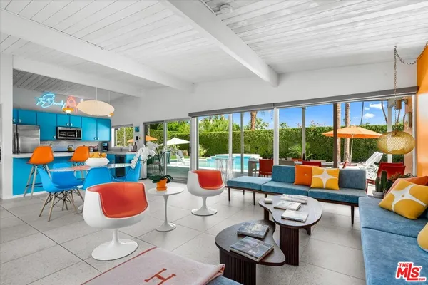 a room with lots of tables and chairs