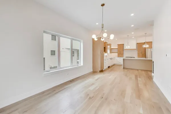 a view of a room with cabinet and windows