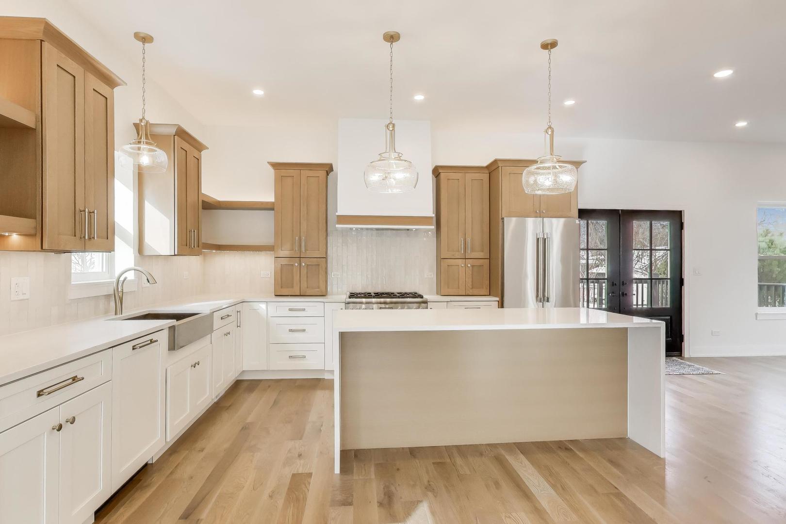 280 Blackhawk Road Riverside, IL 60546 - Photo 16 of 51 a large kitchen with cabinets wooden floor and a sink