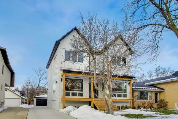 a view of a building with a large tree