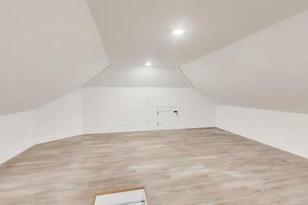 an empty room with wooden floor