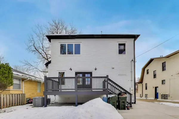 a view of a house with a snow in the yard