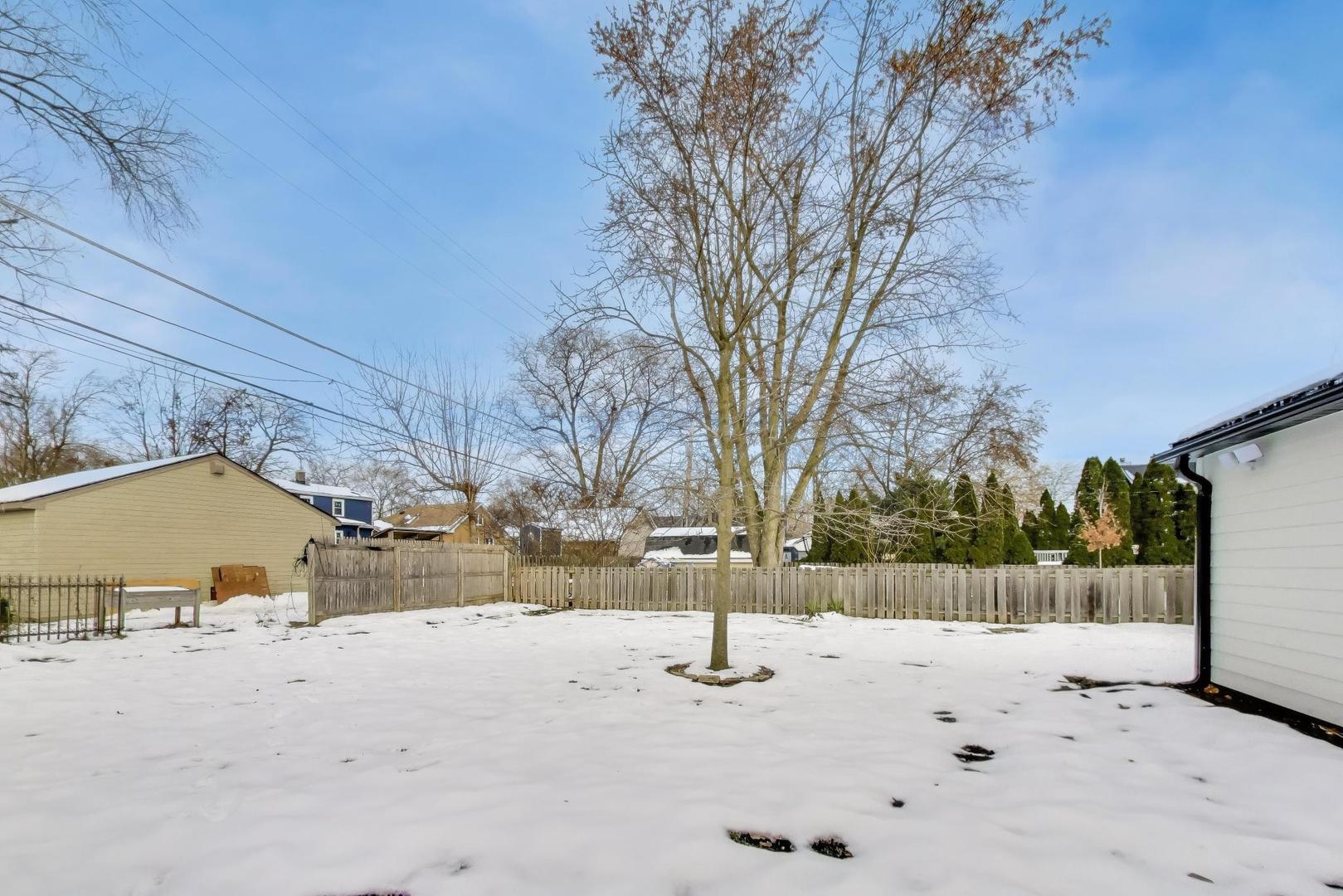 280 Blackhawk Road Riverside, IL 60546 - Photo 43 of 51 a view of a yard covered in snow
