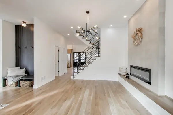 a view of a room with gym equipment and a large mirror