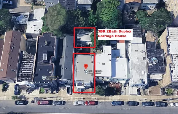 a view of a patio with a table and chairs
