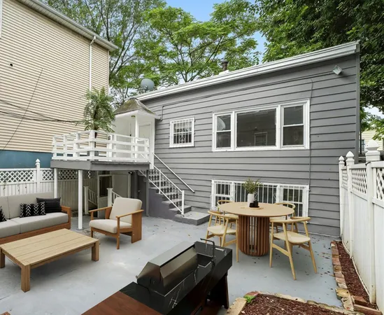 a kitchen with stainless steel appliances kitchen island a stove a sink and a refrigerator