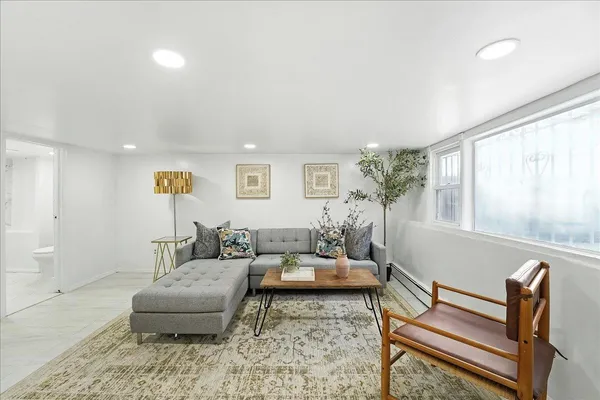 a living room with furniture and a table