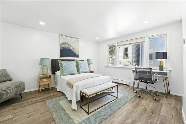 a bedroom with a bed and glass window