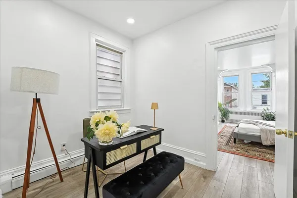a kitchen with stainless steel appliances white cabinets white stove a microwave and a refrigerator