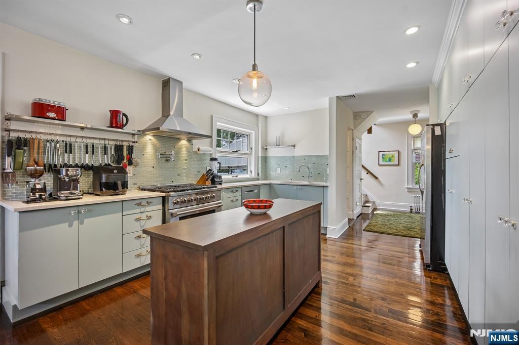 57 Oldis Street Rochelle Park, NJ 07662 - Photo 6 of 19 a kitchen with stainless steel appliances granite countertop a stove and a refrigerator