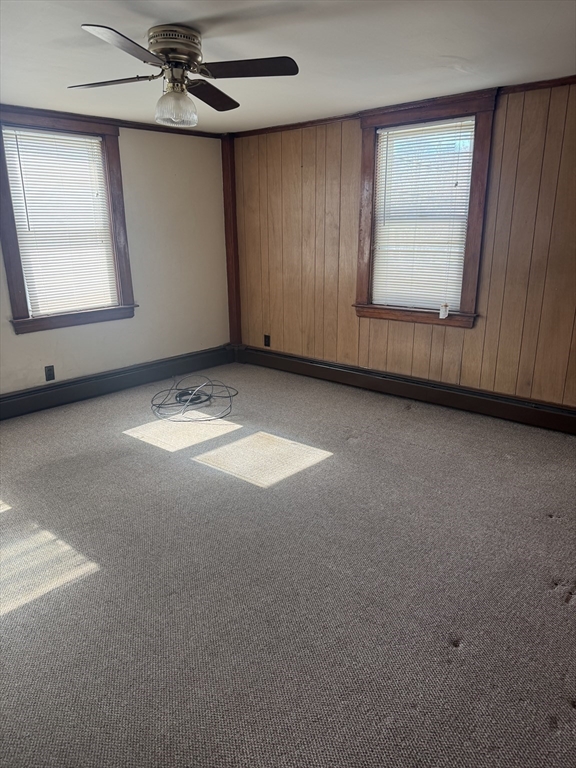 190 Medway Road, Unit A Milford, MA 01757 - Photo 5 of 7 an empty room with windows