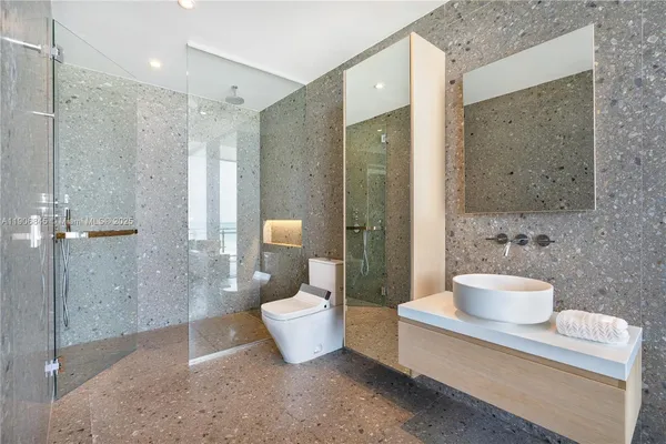 a spacious bathroom with a shower and a toilet