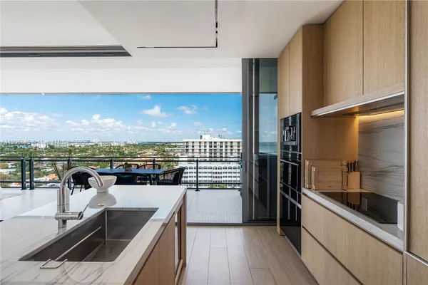 a view of a kitchen with a sink and dishwasher
