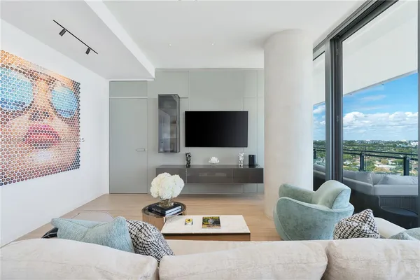 a living room with fireplace furniture and a flat screen tv