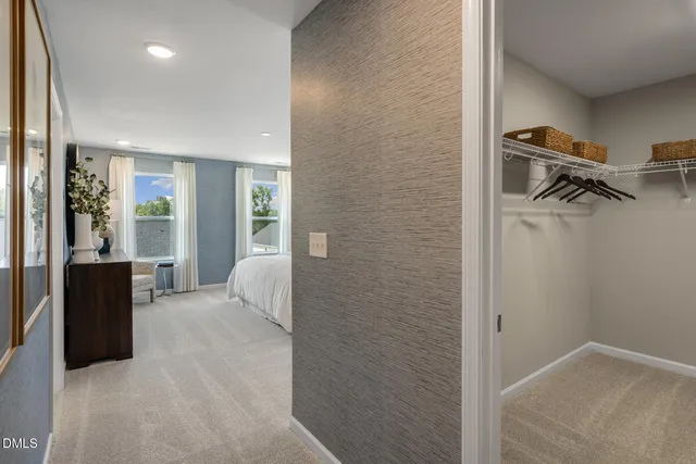a view of a bedroom with closet