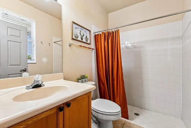 an aerial view of residential houses with outdoor space and swimming pool