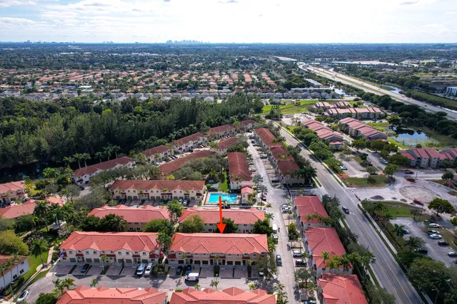 an aerial view of city parking and river