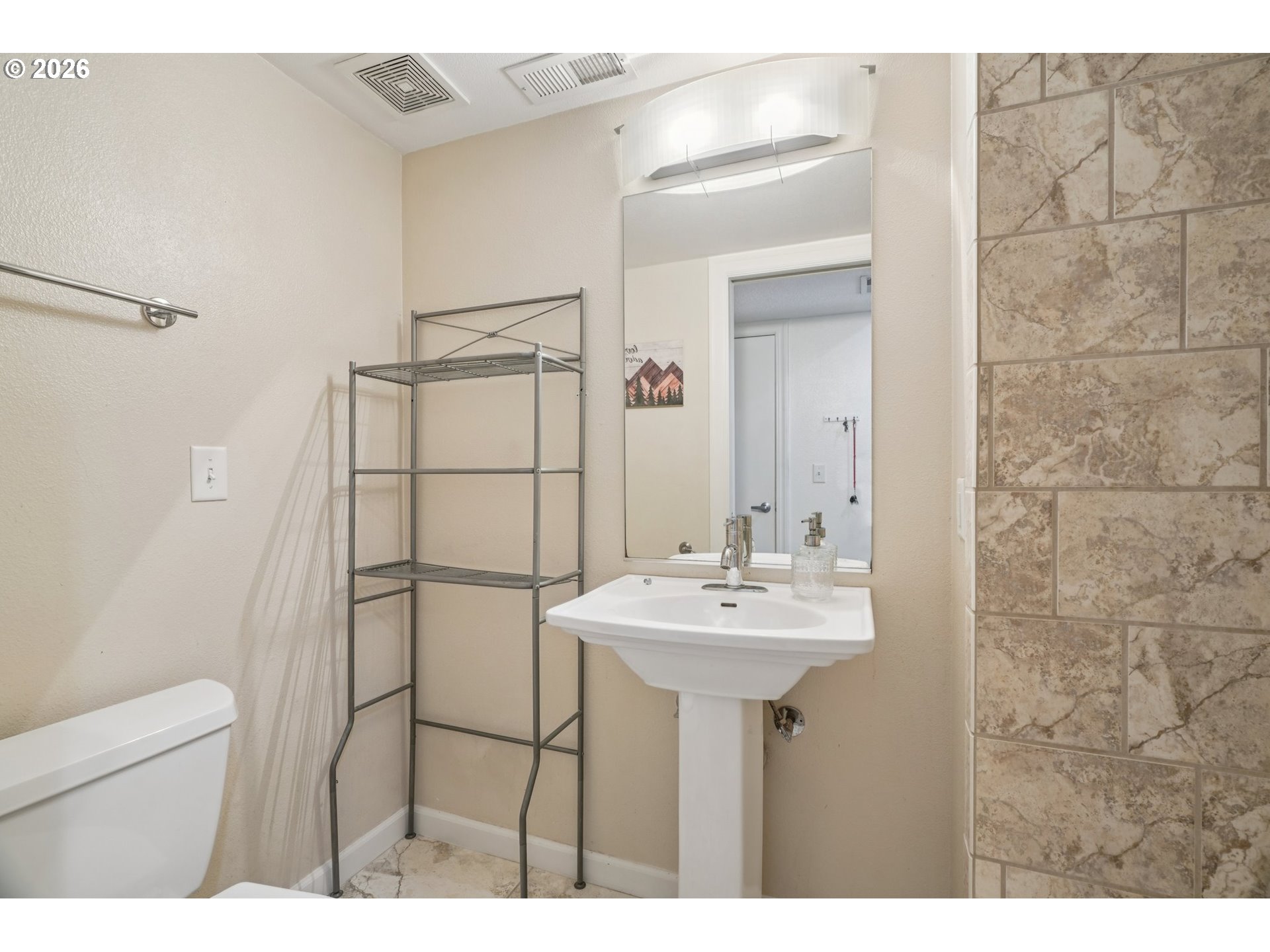 6600 Southeast Division Street, Unit 305 Portland, OR 97206 - Photo 17 of 34 a bathroom with a sink mirror and shower