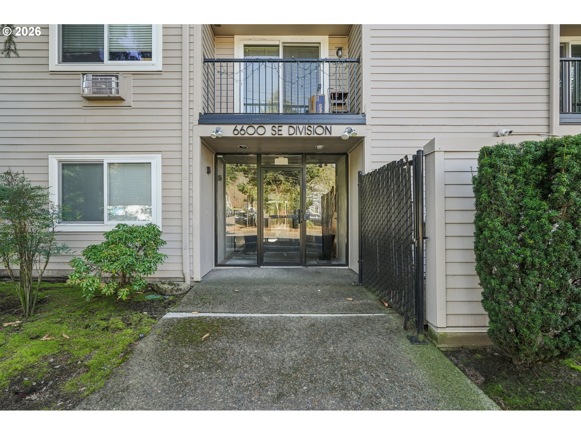 6600 Southeast Division Street, Unit 305 Portland, OR 97206 - Photo 2 of 34 a front view of a house with a garden