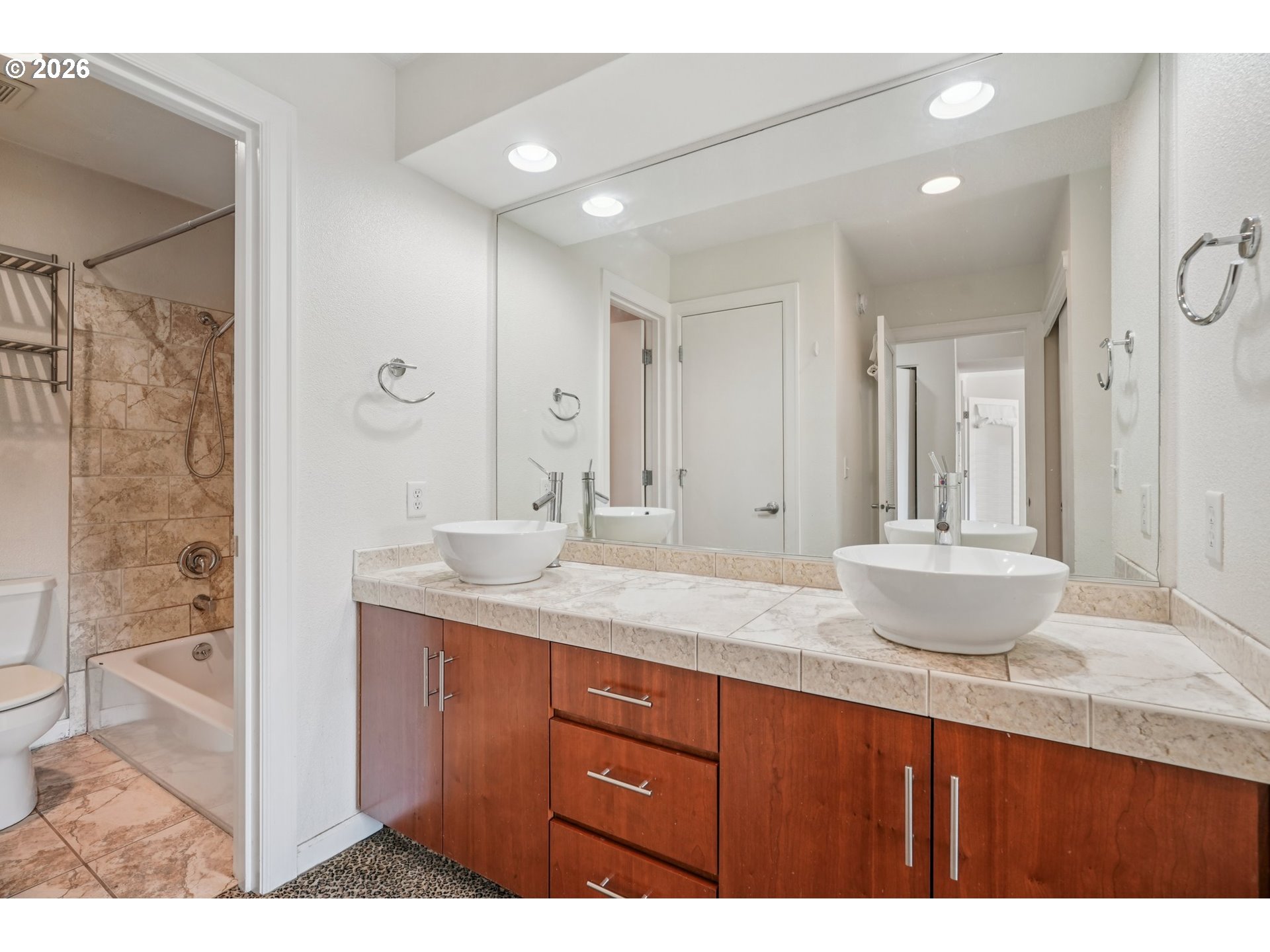 6600 Southeast Division Street, Unit 305 Portland, OR 97206 - Photo 22 of 34 a bathroom with a granite countertop sink mirror and double