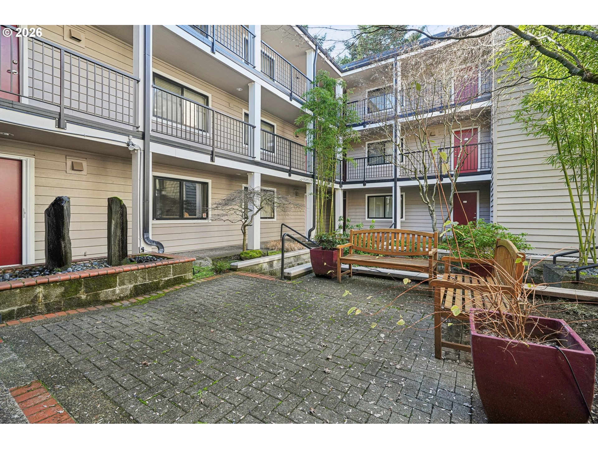 6600 Southeast Division Street, Unit 305 Portland, OR 97206 - Photo 30 of 34 a backyard of a house with barbeque oven table and chairs