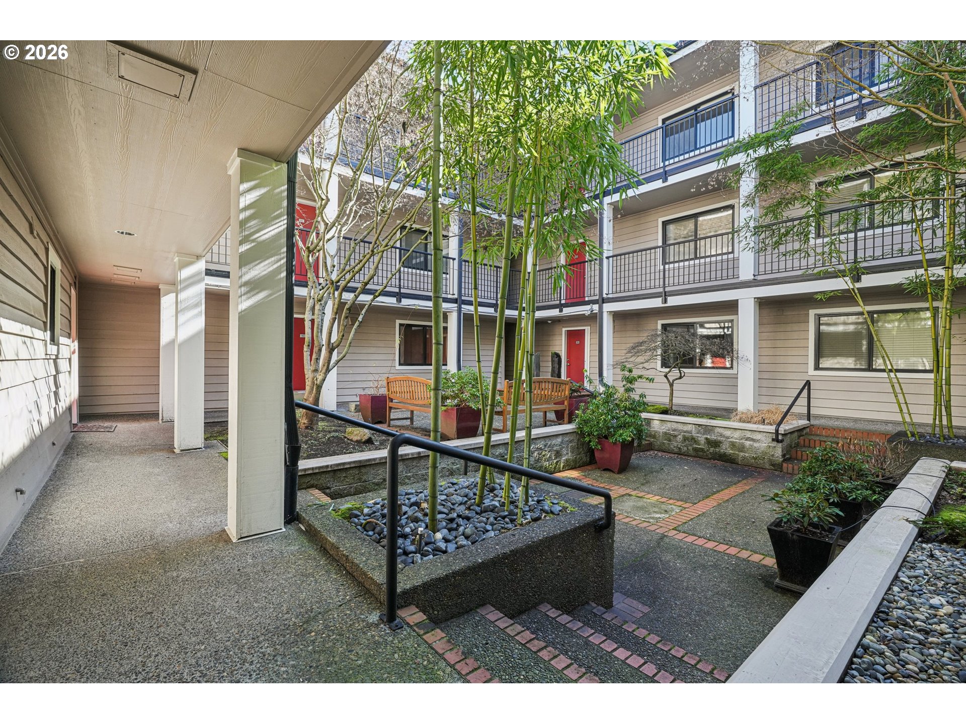 6600 Southeast Division Street, Unit 305 Portland, OR 97206 - Photo 32 of 34 a view of a house with a wooden deck