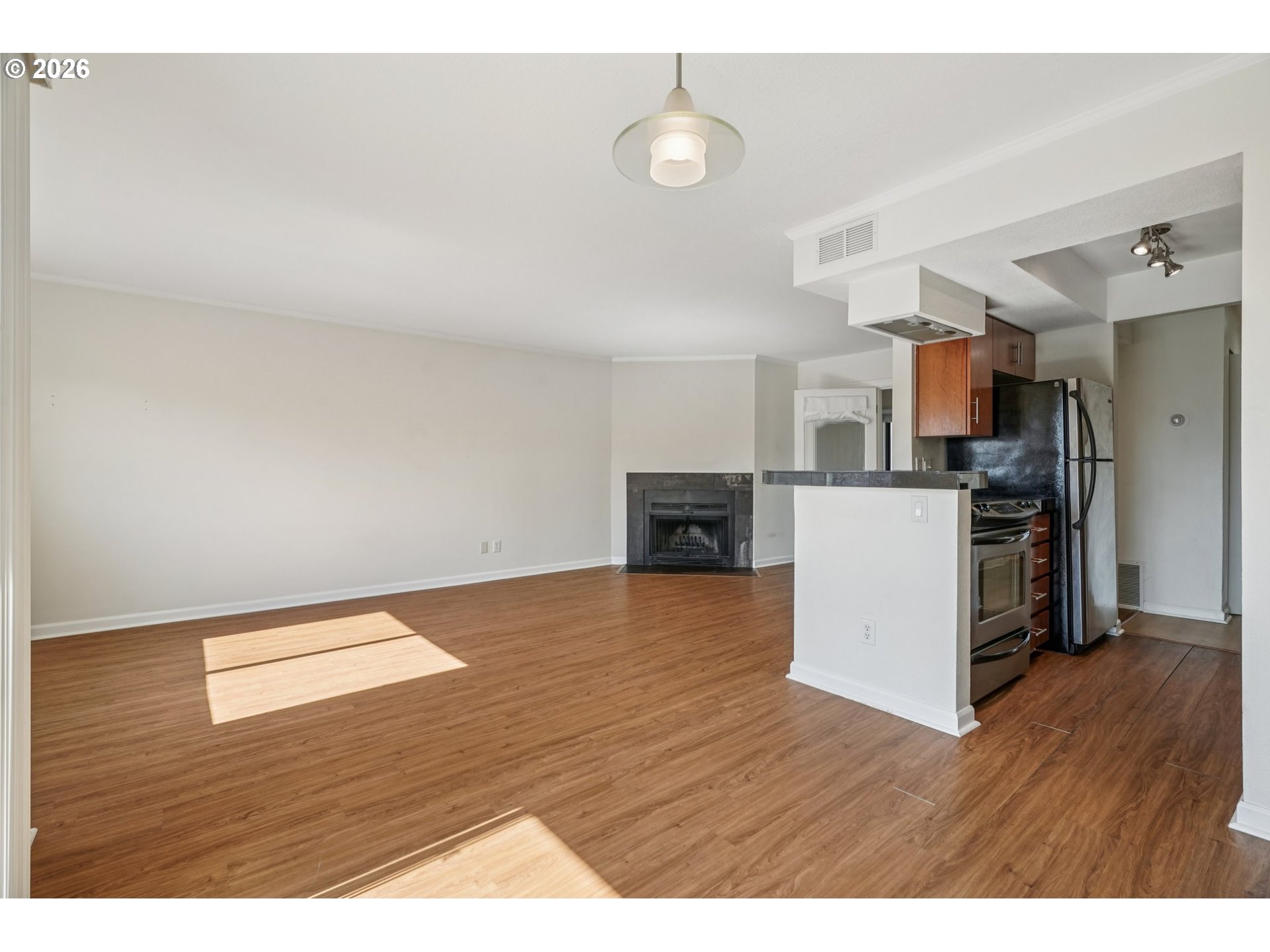 6600 Southeast Division Street, Unit 305 Portland, OR 97206 - Photo 10 of 34 a view interior of kitchen and wooden floor