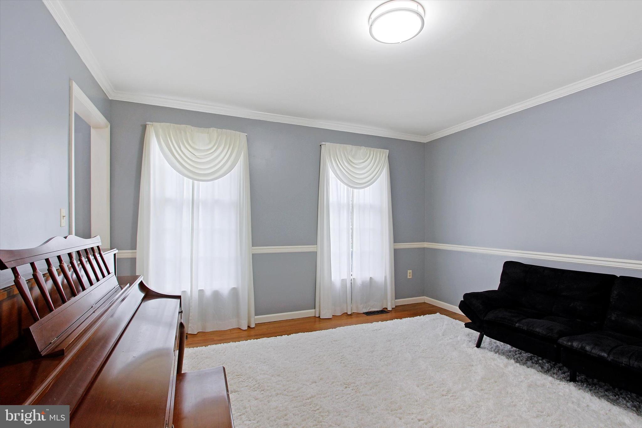 Formal Dining Room currently used as piano room.