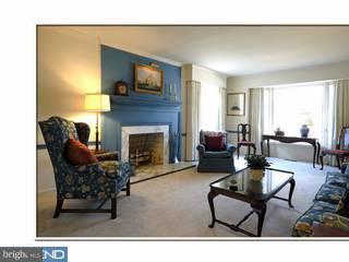 616 Bayard Road Kennett Square, PA 19348 - Photo 2 of 6 a living room with furniture a flat screen tv and a fireplace