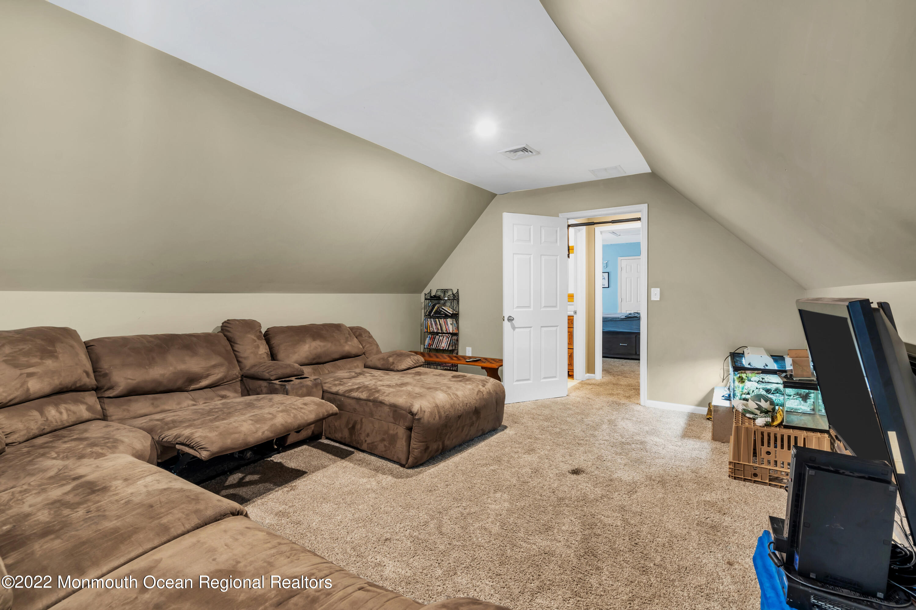 554 Whitecomb Avenue Jackson, NJ 08527 - Photo 22 of 112 a living room with furniture a flat screen tv and a window