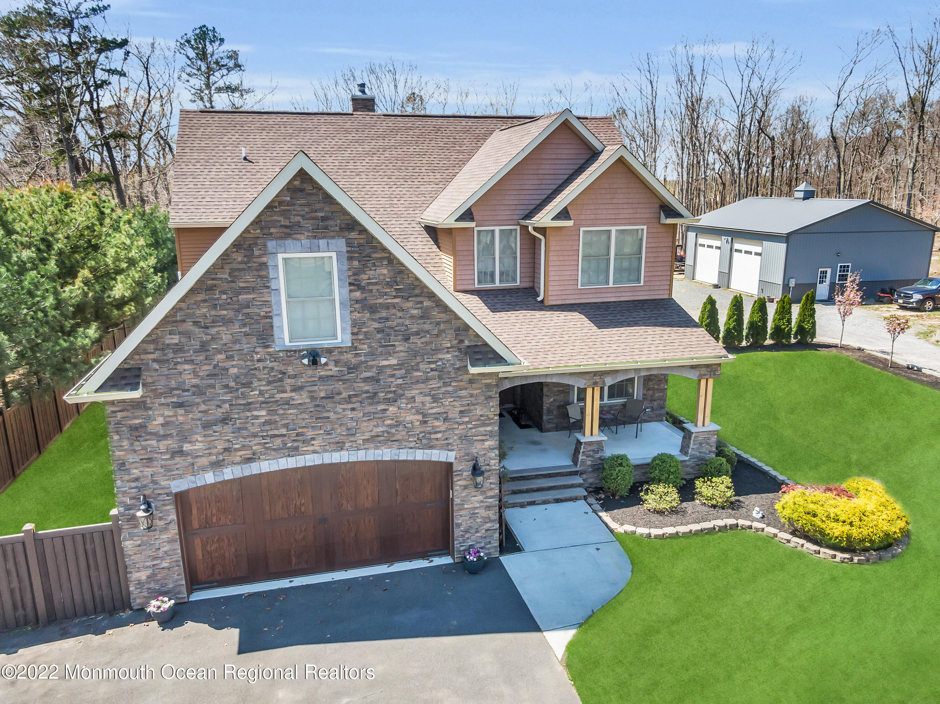 554 Whitecomb Avenue Jackson, NJ 08527 - Photo 45 of 112 a front view of a house with a garden and yard