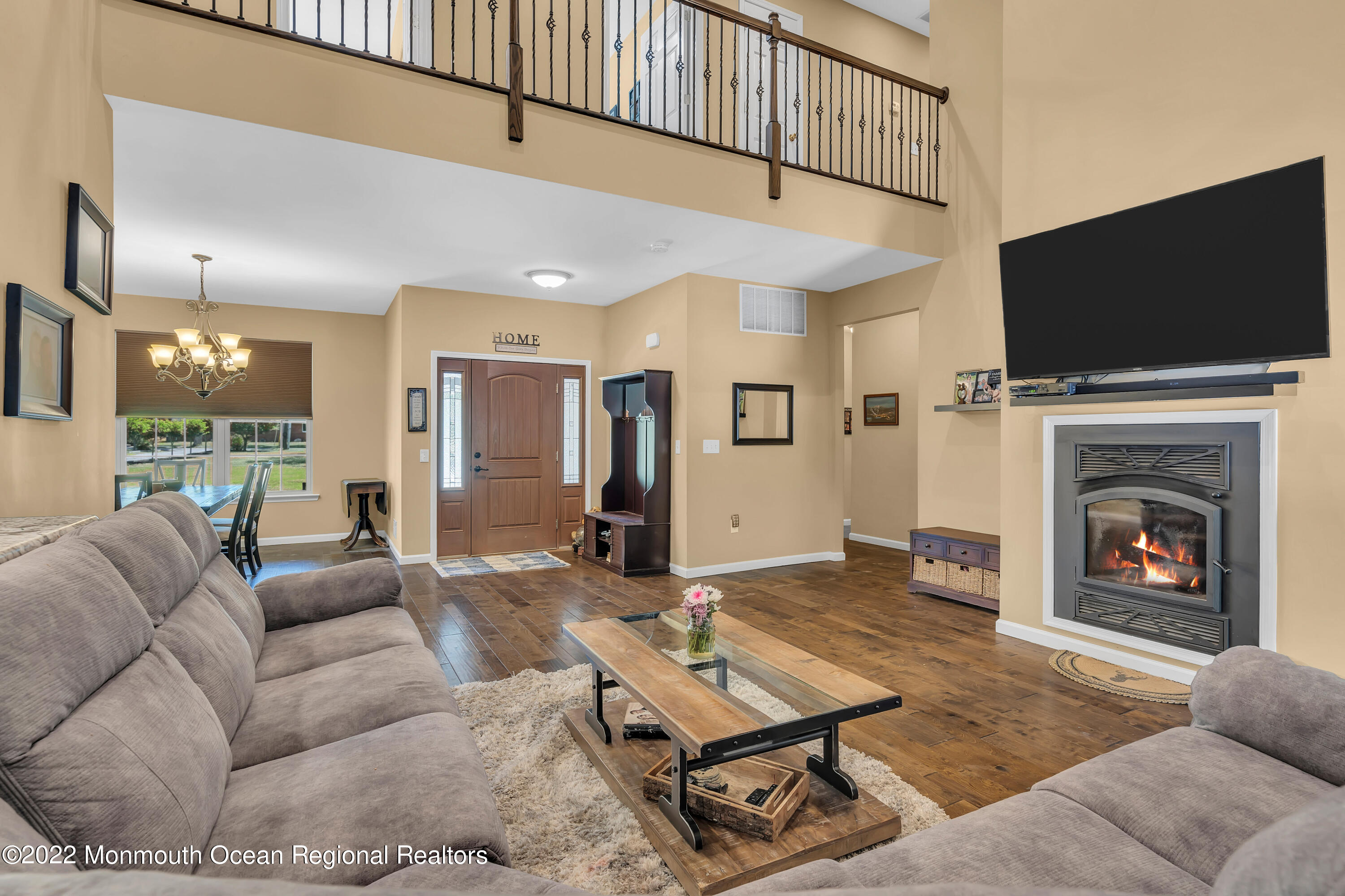 554 Whitecomb Avenue Jackson, NJ 08527 - Photo 5 of 112 a living room with furniture a flat screen tv and a fireplace