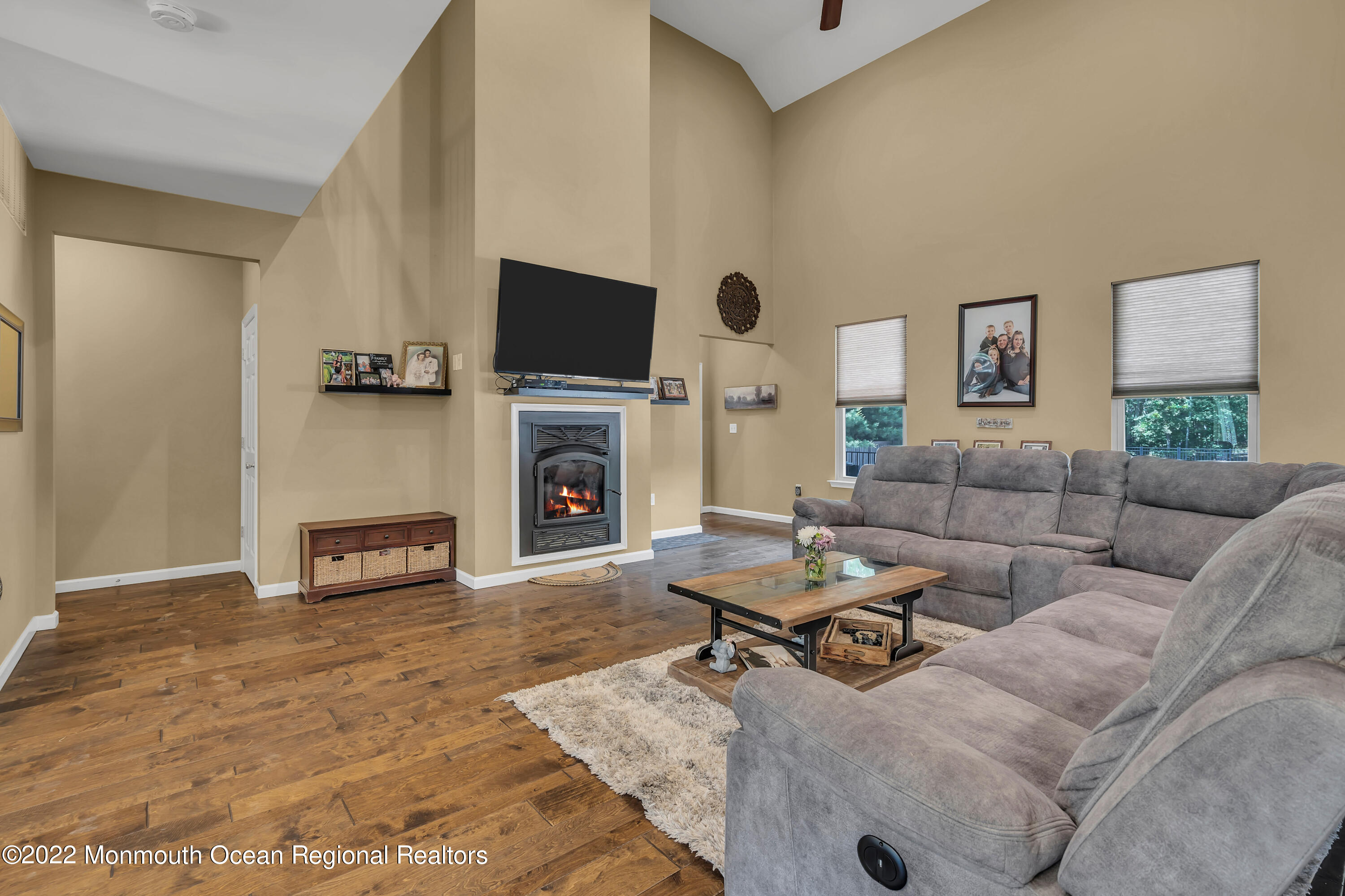554 Whitecomb Avenue Jackson, NJ 08527 - Photo 7 of 112 a living room with furniture a fireplace and a flat screen tv
