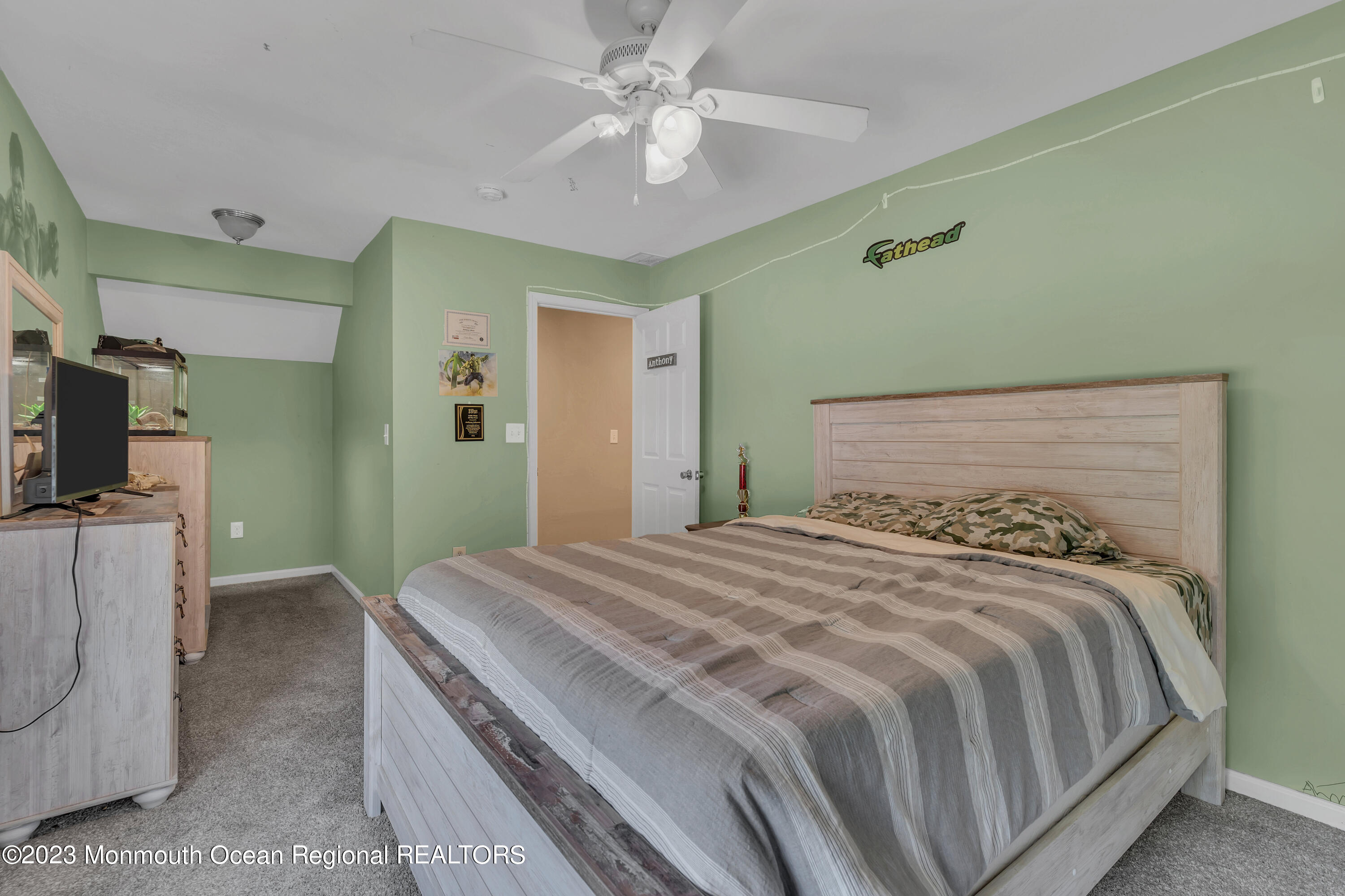554 Whitecomb Avenue Jackson, NJ 08527 - Photo 85 of 112 a bedroom with a bed and a chandelier