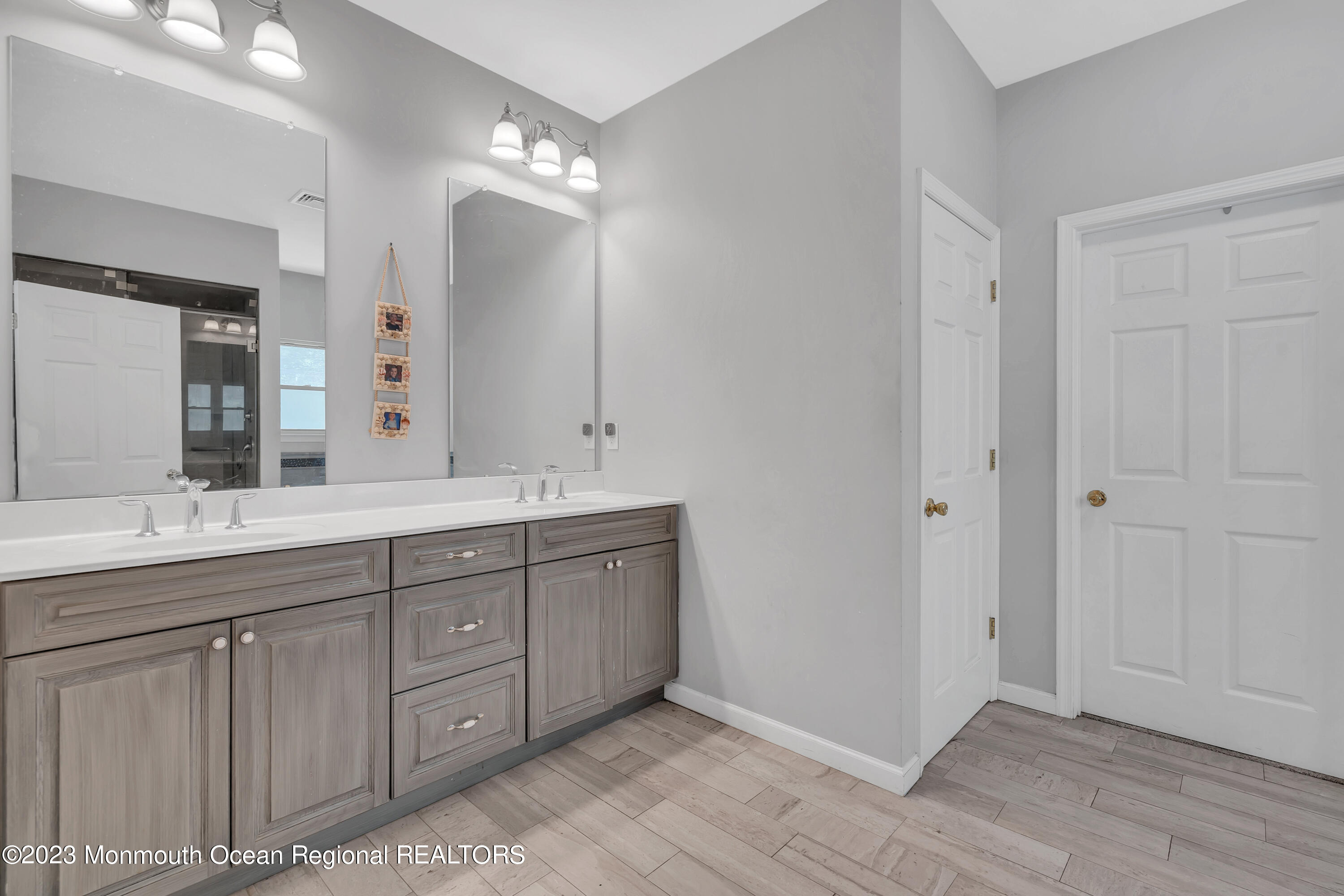 554 Whitecomb Avenue Jackson, NJ 08527 - Photo 92 of 112 a spacious bathroom with a double vanity sink and a mirror
