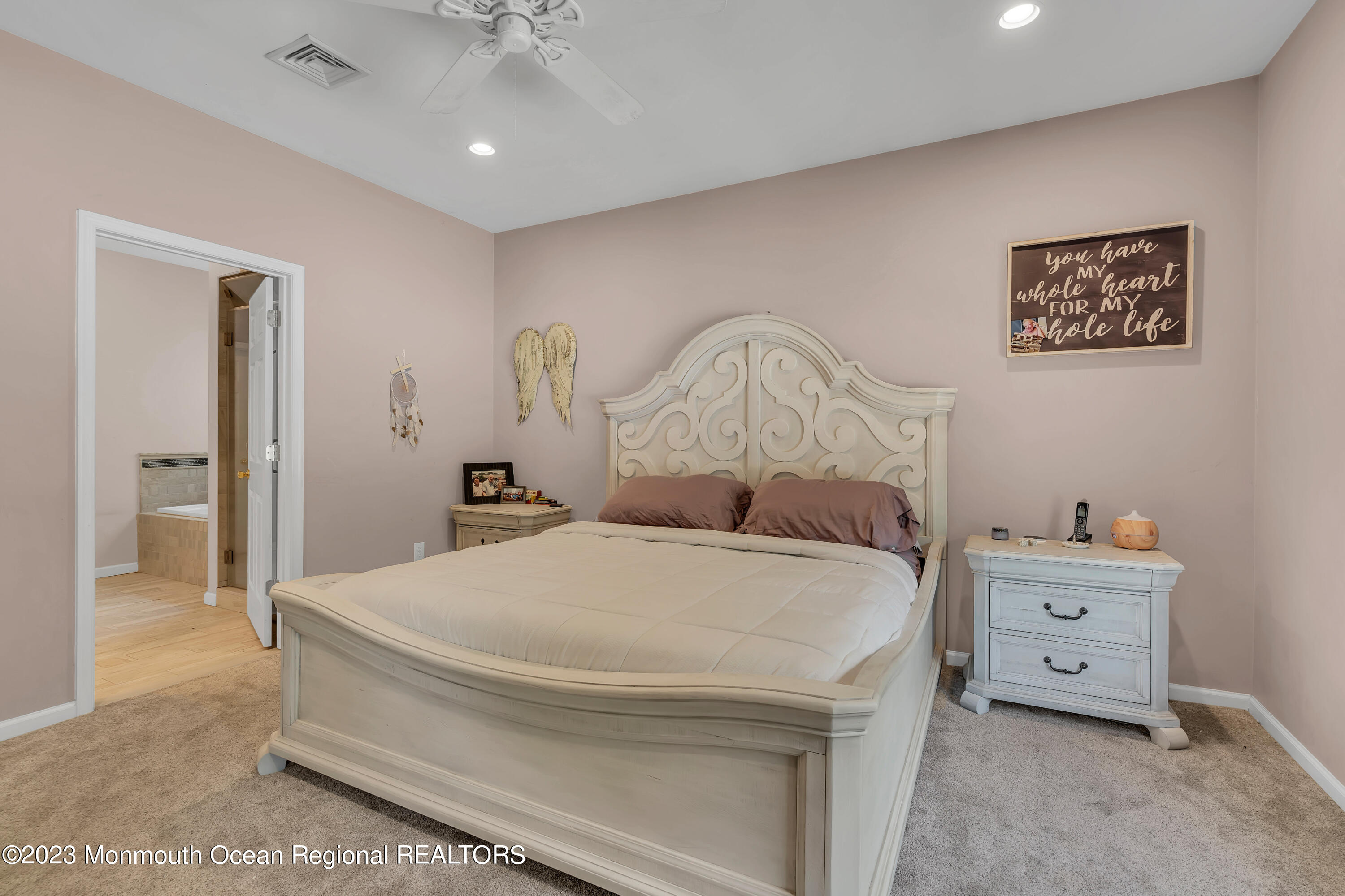 554 Whitecomb Avenue Jackson, NJ 08527 - Photo 97 of 112 a bed room with a bed and a chandelier