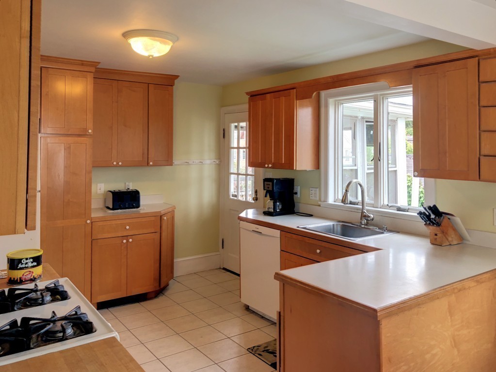 22 Sumner Road Salem, MA 01970 - Photo 3 of 30 a kitchen with a sink stove and window
