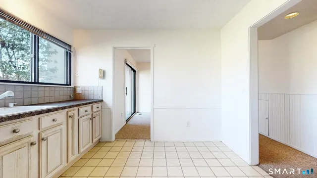 a bathroom with a sink a mirror and a shower