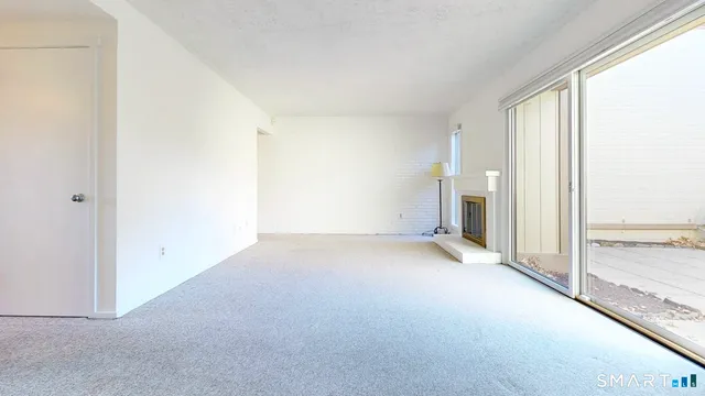 an empty room with fireplace