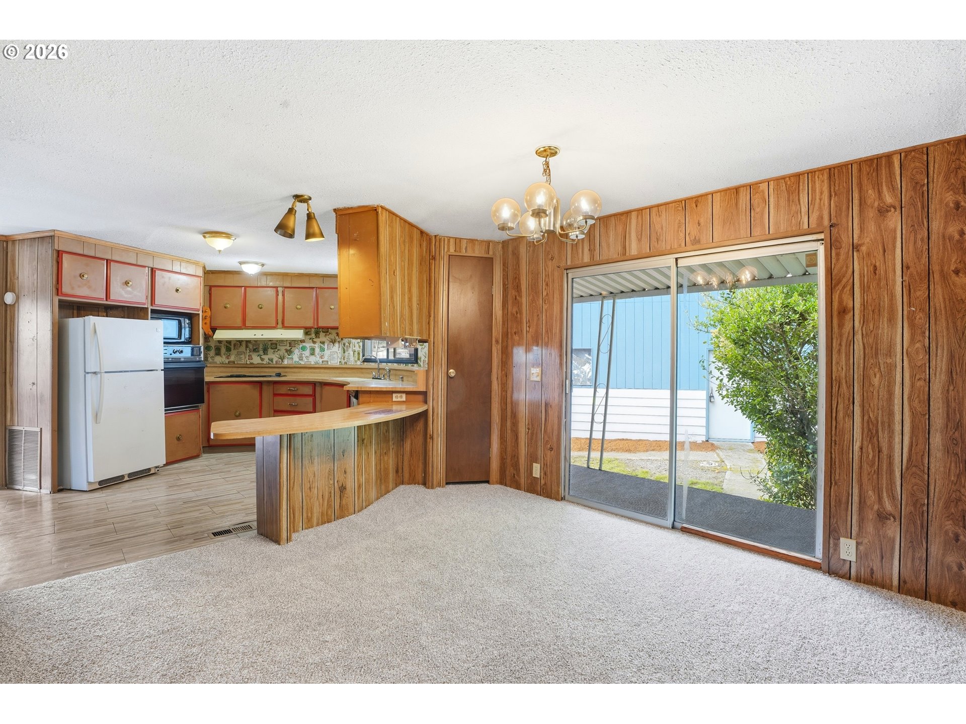 34931 Jackson Way, Unit 36 Scappoose, OR 97056 - Photo 14 of 35 a kitchen with stainless steel appliances a stove a refrigerator and a sink