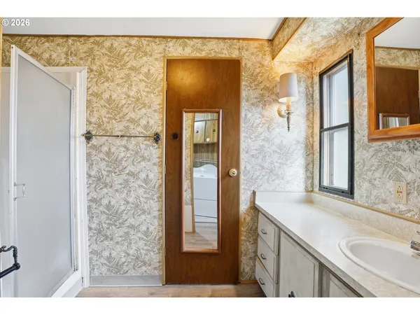 a bathroom with a sink and a mirror