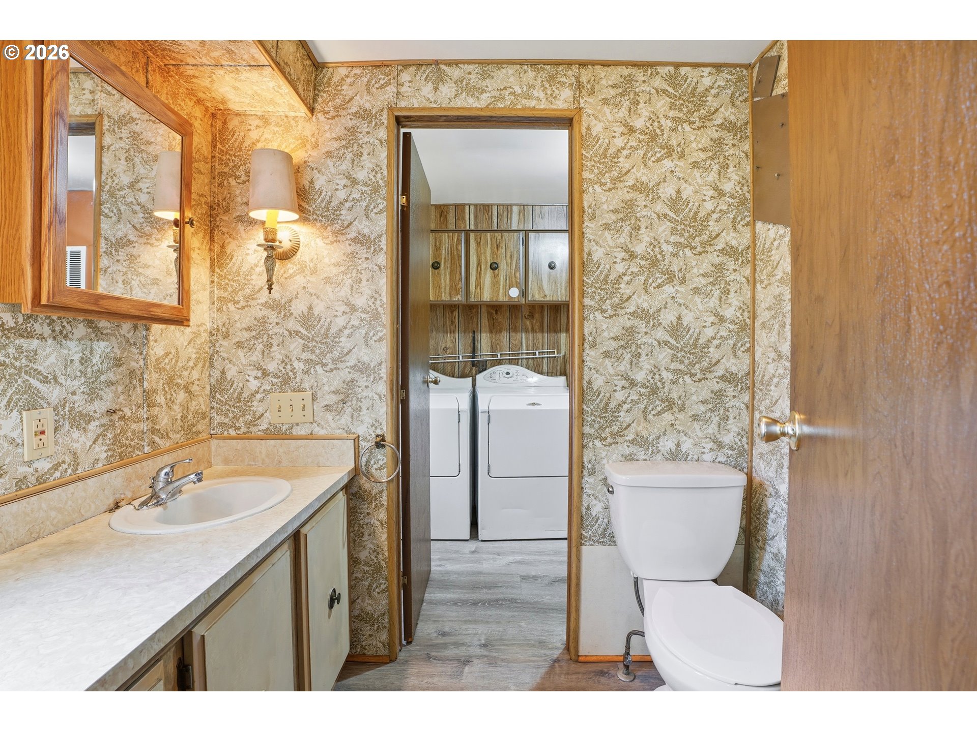34931 Jackson Way, Unit 36 Scappoose, OR 97056 - Photo 17 of 35 a bathroom with a sink toilet a mirror and shower
