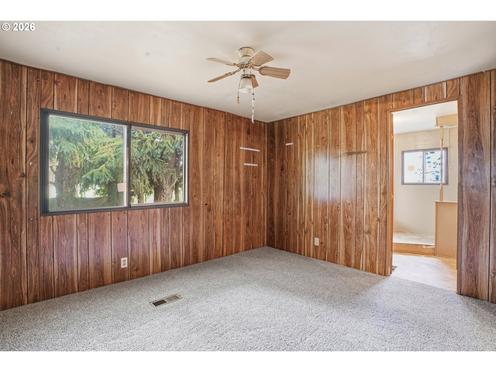 34931 Jackson Way, Unit 36 Scappoose, OR 97056 - Photo 21 of 35 a view of an empty room with a window