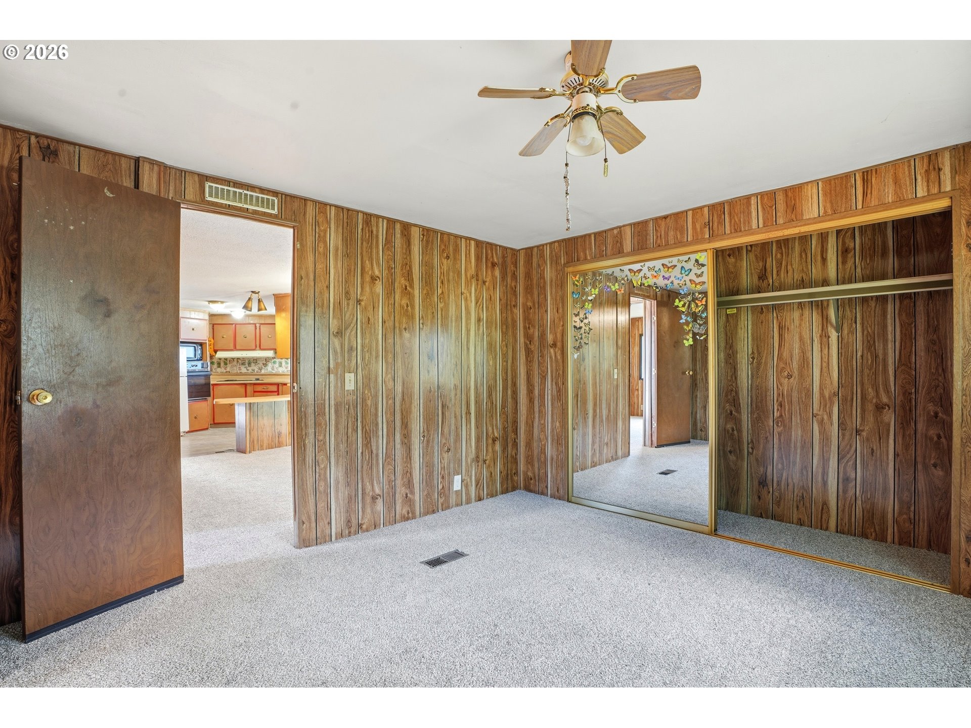 34931 Jackson Way, Unit 36 Scappoose, OR 97056 - Photo 23 of 35 a living room with hardwood floor and a ceiling fan