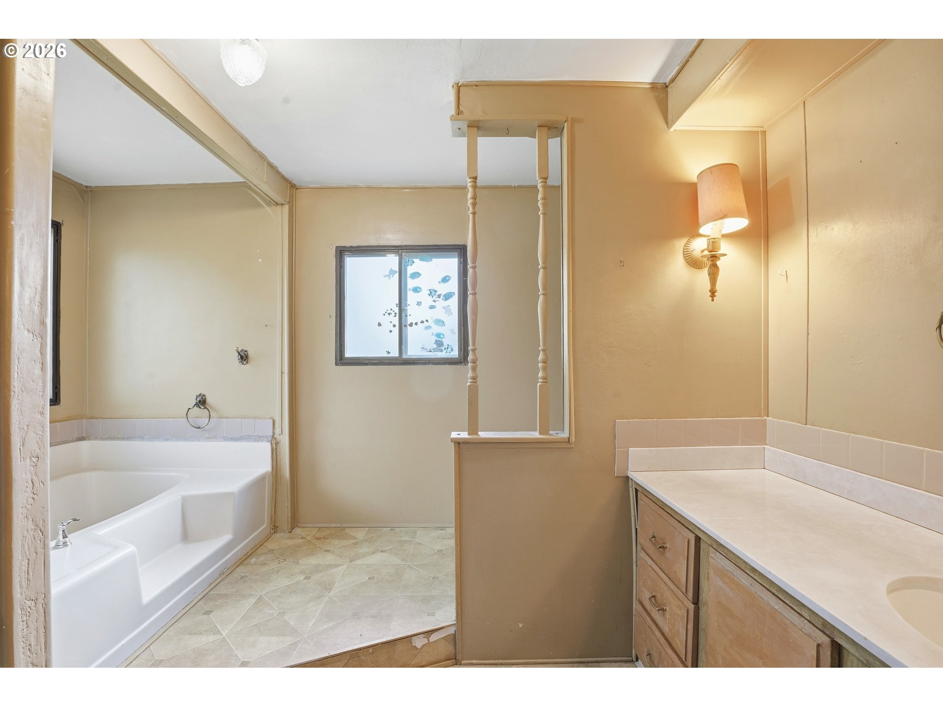 34931 Jackson Way, Unit 36 Scappoose, OR 97056 - Photo 25 of 35 a bathroom with a tub sink and mirror