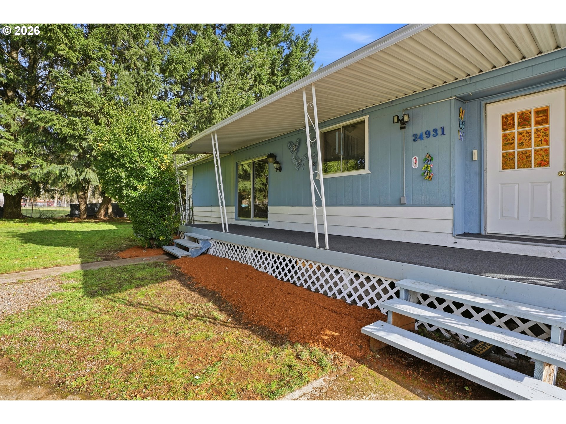 34931 Jackson Way, Unit 36 Scappoose, OR 97056 - Photo 26 of 35 a view of a house with backyard and garden