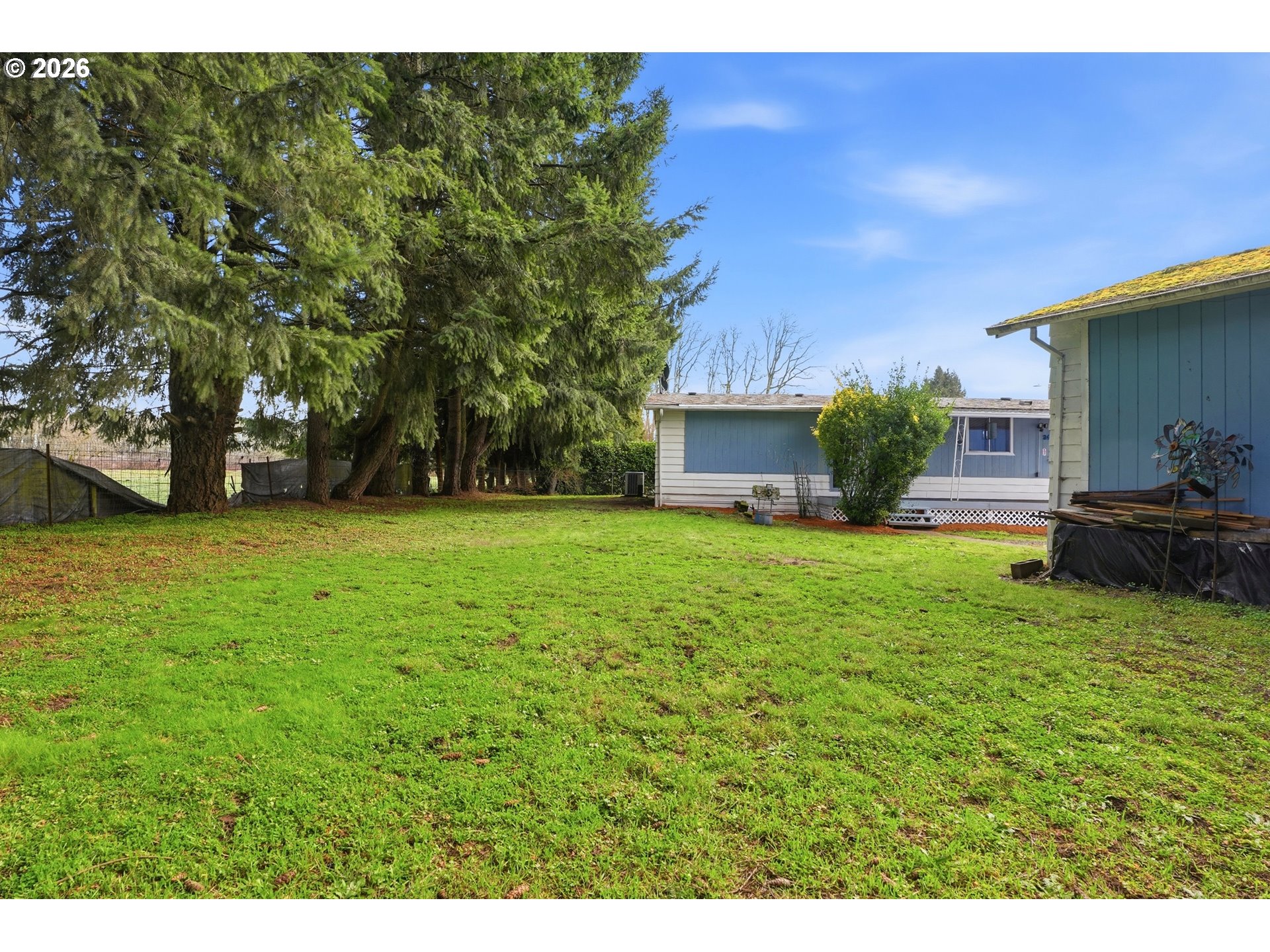 34931 Jackson Way, Unit 36 Scappoose, OR 97056 - Photo 29 of 35 a view of a house with backyard and garden