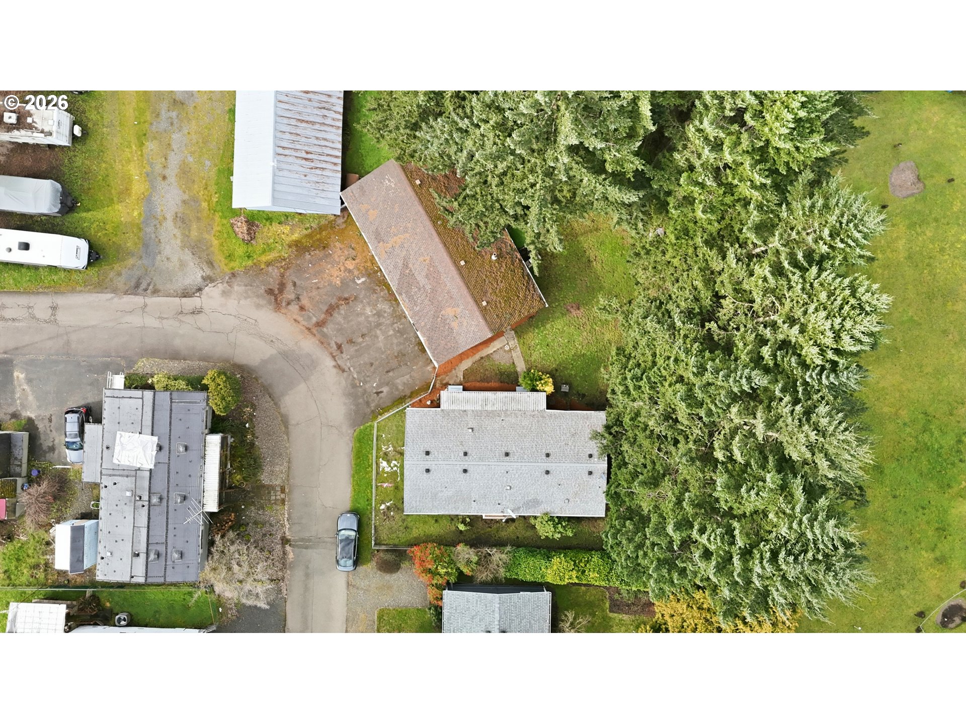 34931 Jackson Way, Unit 36 Scappoose, OR 97056 - Photo 31 of 35 a picture of a book and a yard