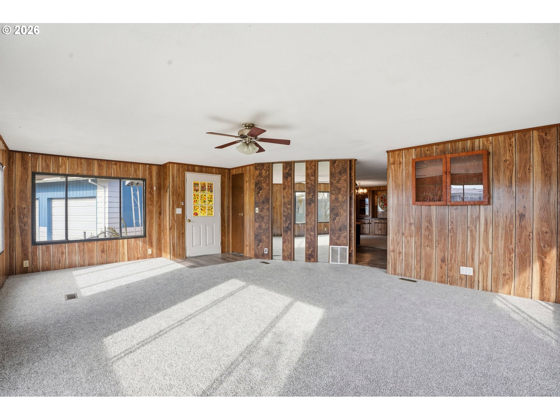 34931 Jackson Way, Unit 36 Scappoose, OR 97056 - Photo 5 of 35 a bedroom with a large bed and large window